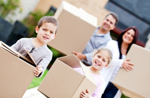 Professional movers handling boxes and furniture for a Kingsbury relocation